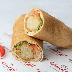 Experience the signature falafel sandwich from Abou Andre! This sandwich features protein-packed falafel balls bursting with fiber, made with fresh ingredients according to our exclusive recipe.